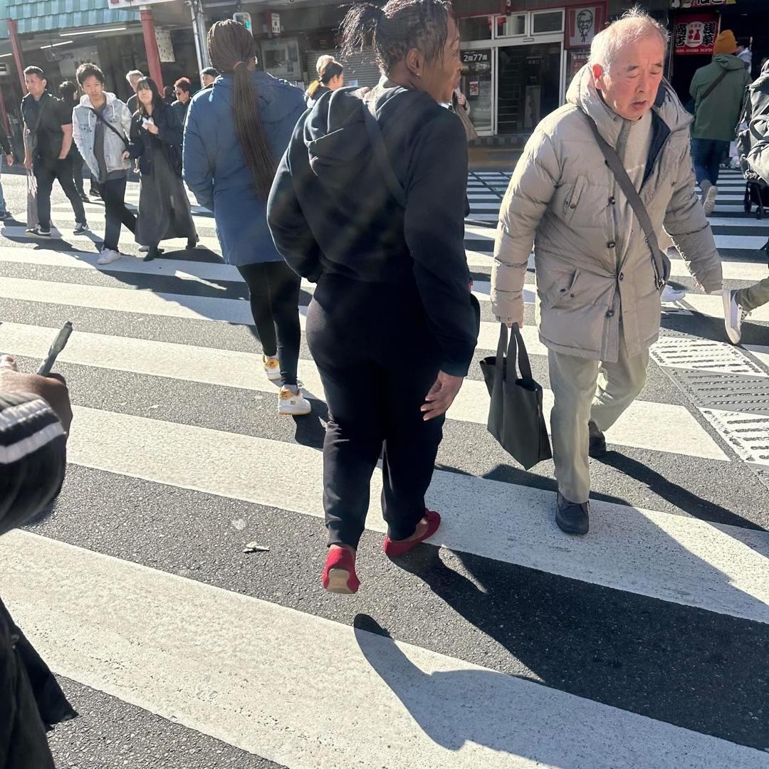 Client crossing a busy street in Tokyo, Japan